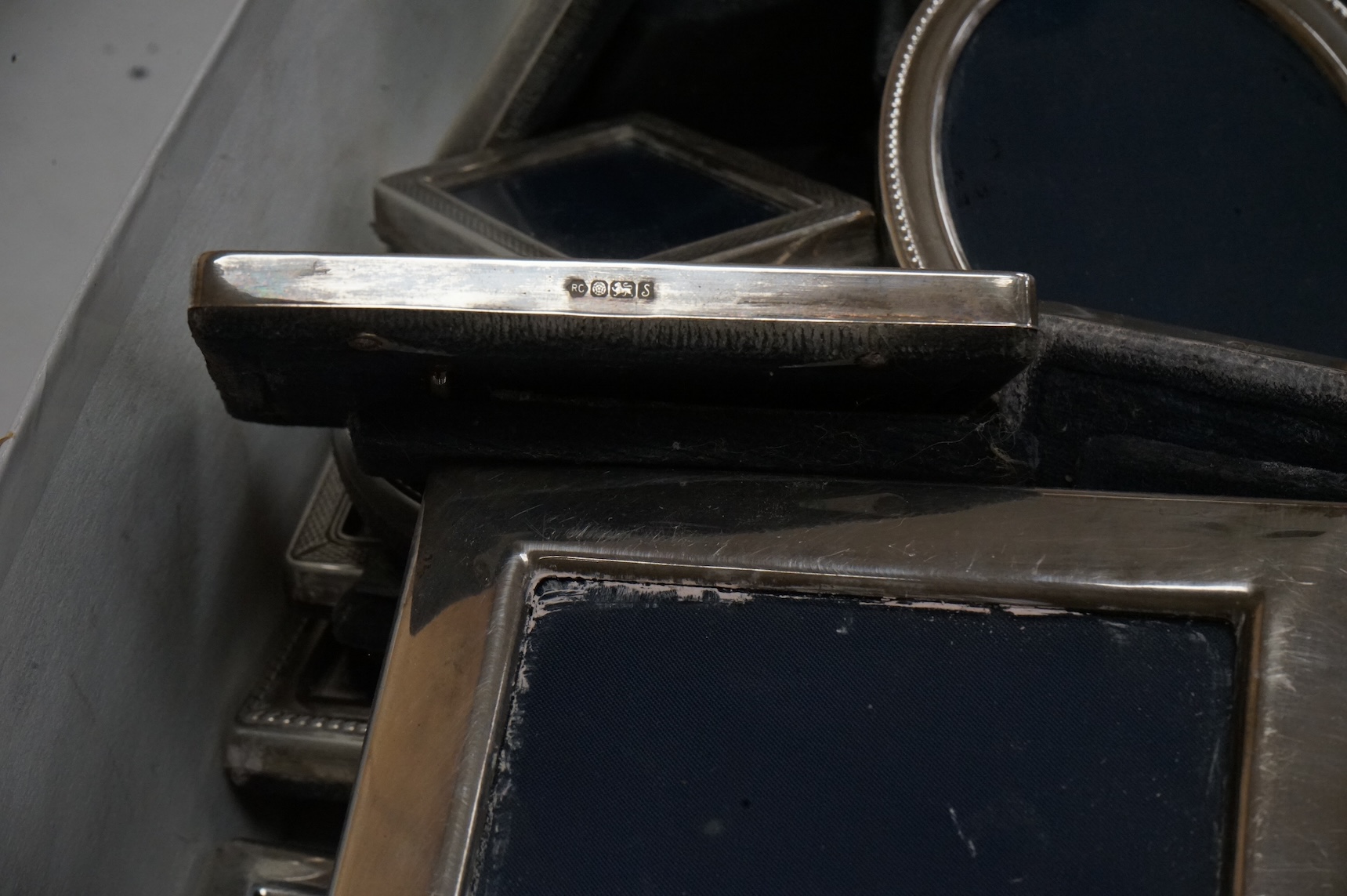 Four assorted pairs of modern silver mounted photograph frames, including Carr's Of Sheffield, 1992/3 and 1990, together with twelve other small assorted modern silver mounted photograph frames, largest 12.9cm and a silv
